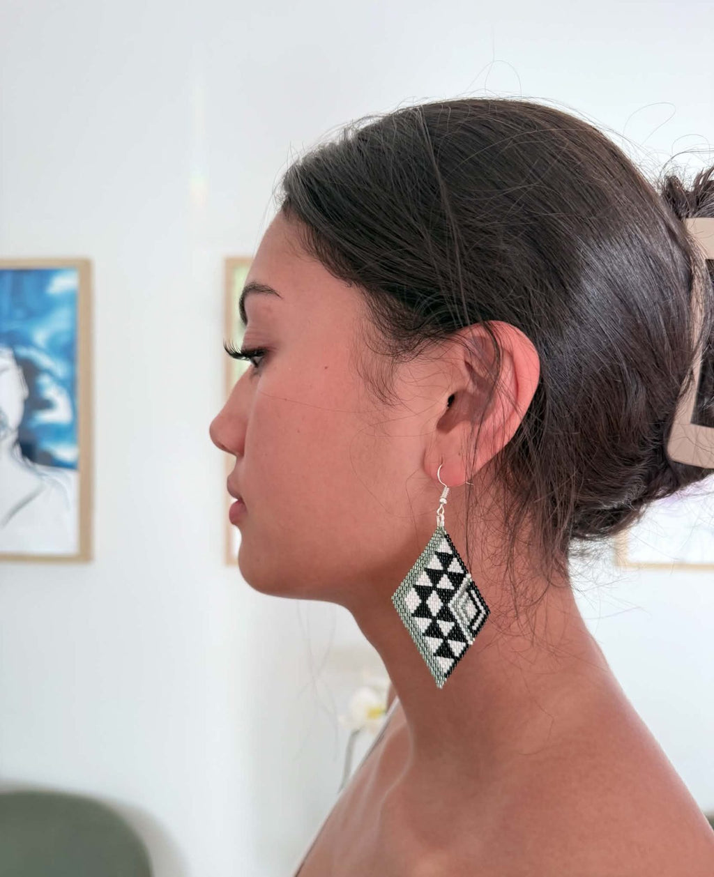 Hori.Inc Piko beaded earrings worn, niho taniwha diamond in sage, black and white