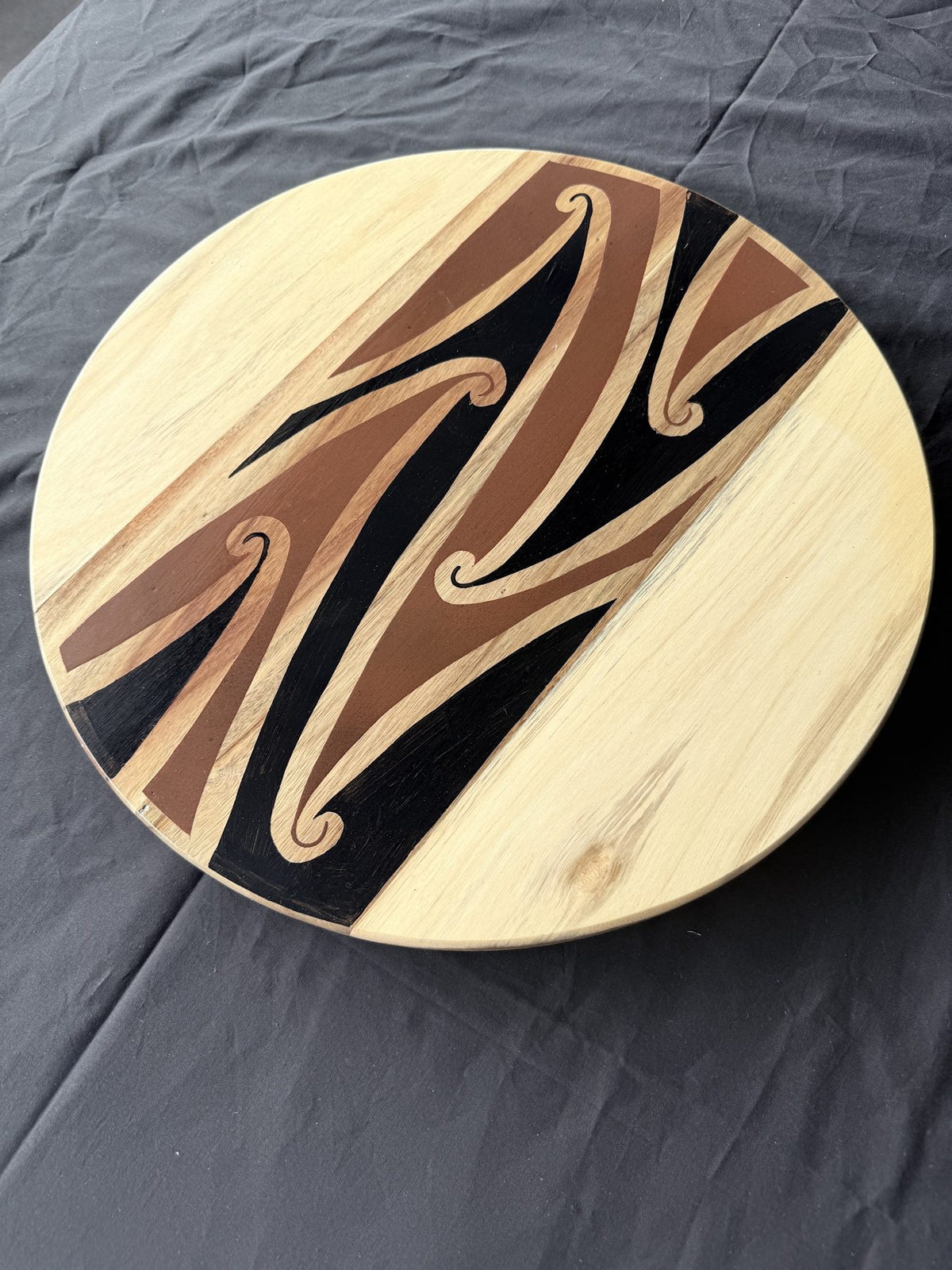 Hori.Inc medium 46cm lazy Susan, brown resin kōwhaiwhai band across the centre