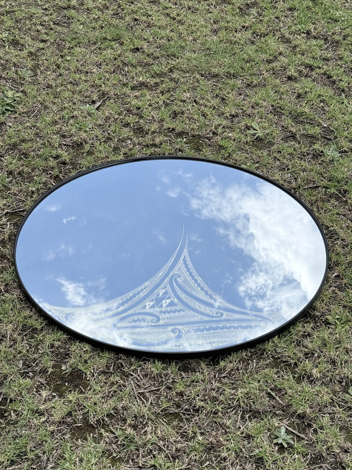 Hori.Inc Wairua Mirror, oval mirror with hand-engraved Māori design