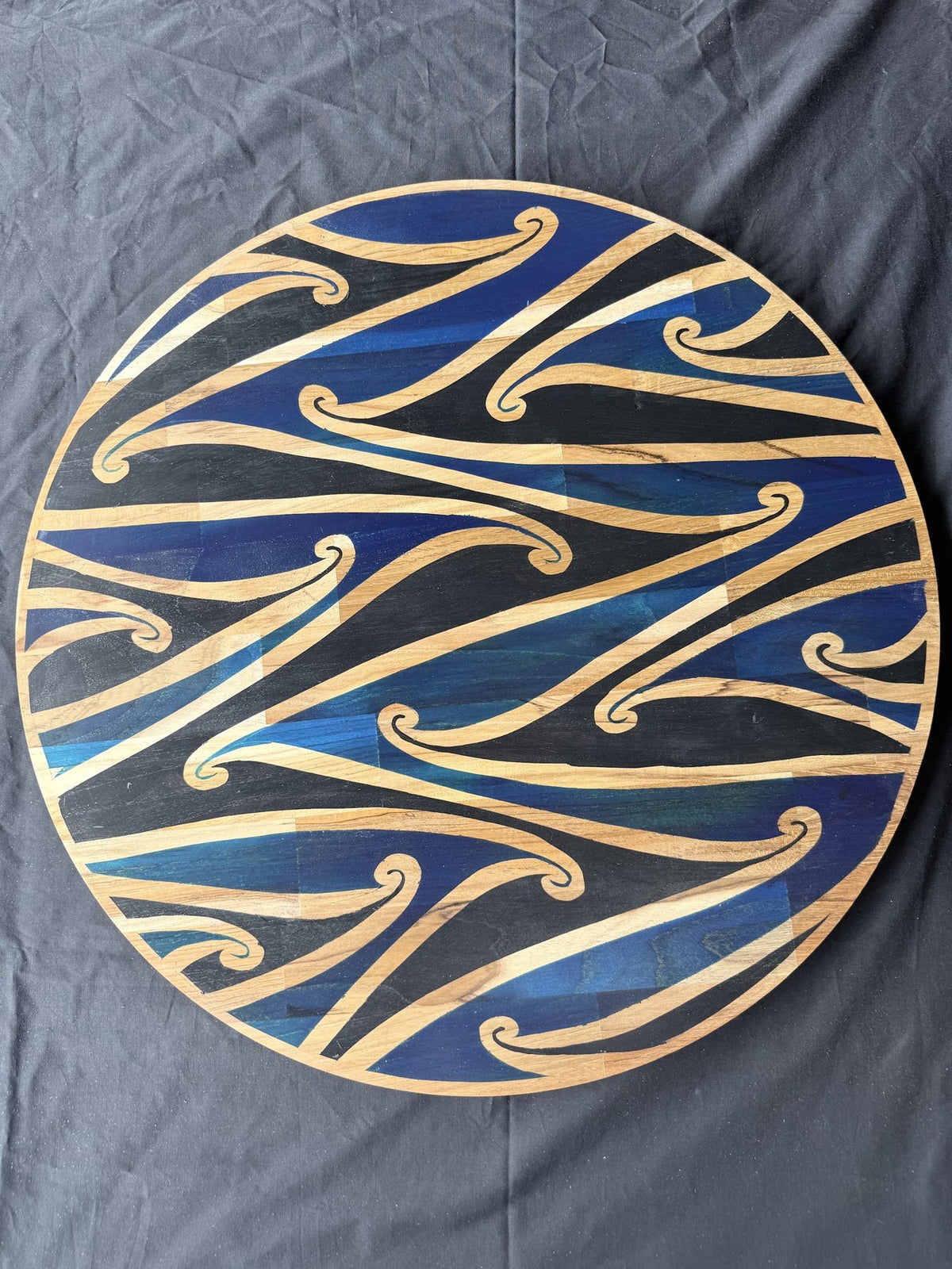 Hori.Inc Kōwhaiwhai platter, blue resin curls across the full board
