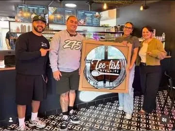 Custom sign commission presented to a café team