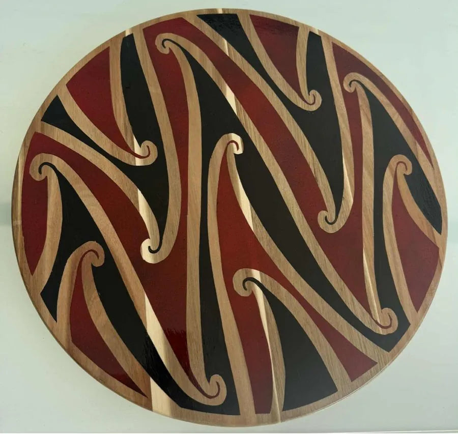 Red and black resin kōwhaiwhai platter by Hori.Inc