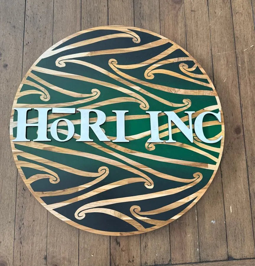 Pounamu green board reading Hori.Inc
